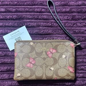 Coach Tan Wristlet with Pink Butterfly Accents
